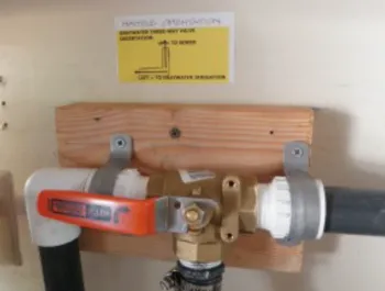 A 3-way laundry valve mounted to a wall