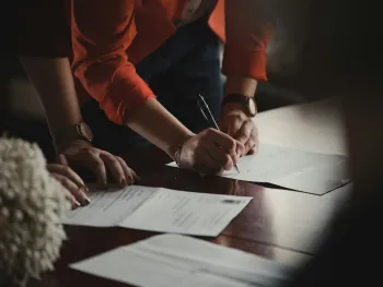 Two people working on grant application