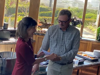 Jennifer Clarke presents Steve Fennimore with a token of recognition for his work