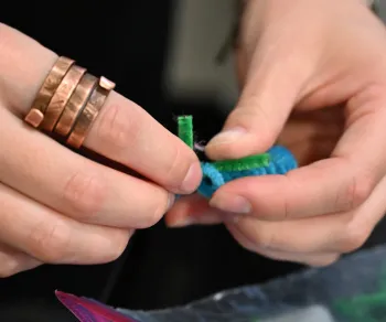 A pipe cleaner caterpillar in the making. (Photo by Kathy Keatley Garvey)